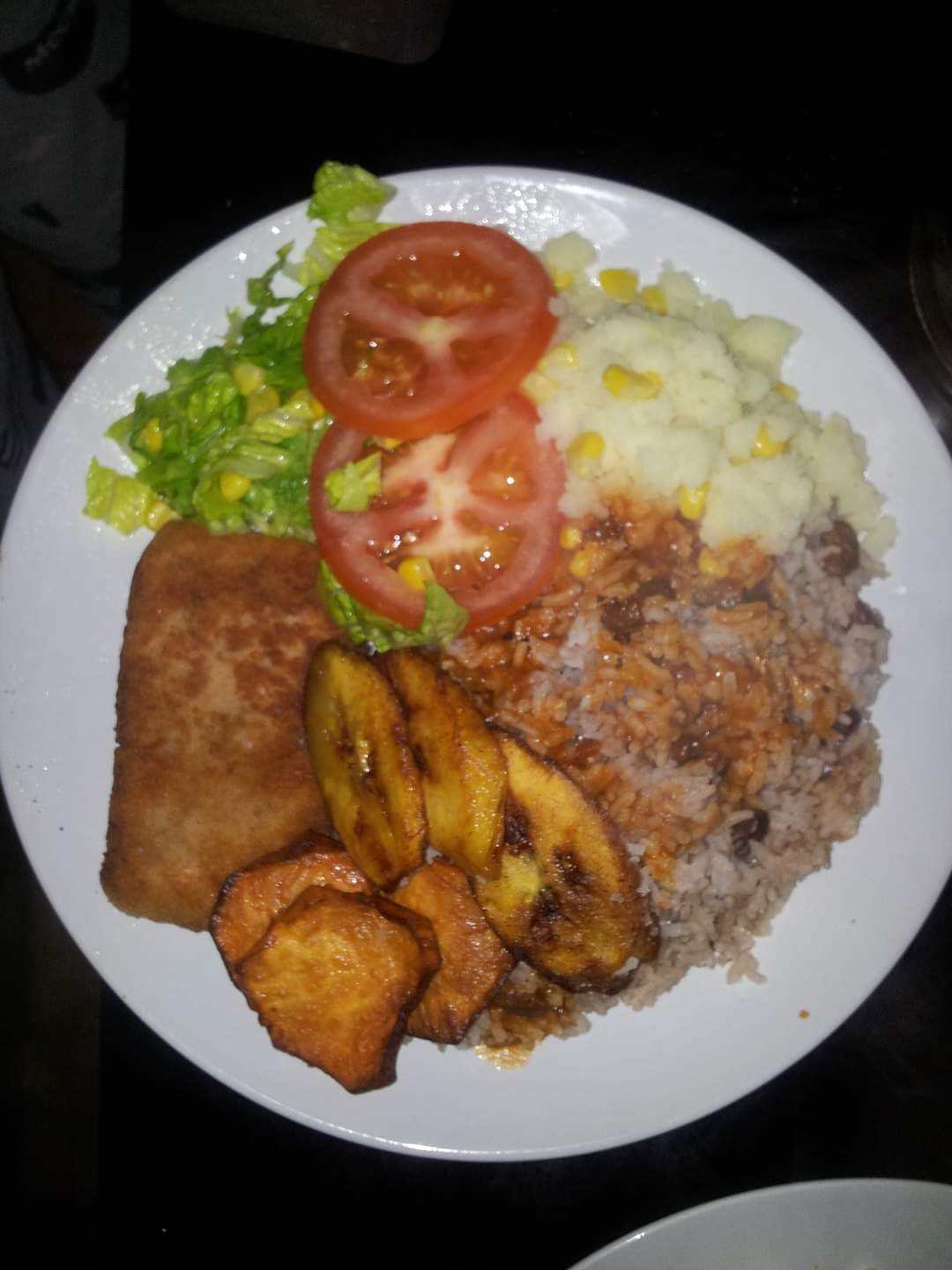 Escalope Fish with Rice & Peas, Mash Potatoes fried Plantings & fried sweets potatoes 🥔  Image