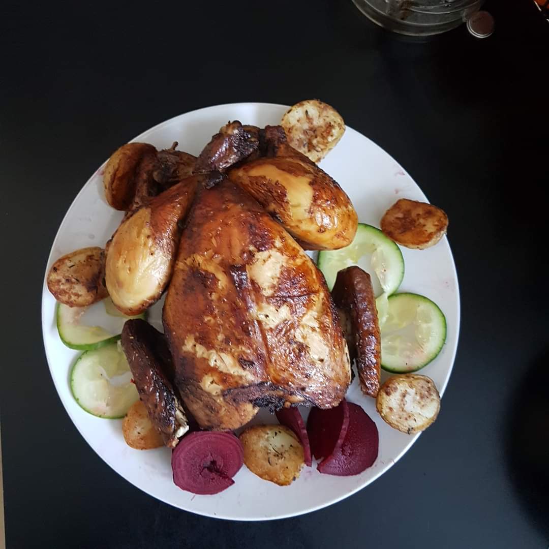 Baked Chicken & roast potatoes garnish with beetroot & cucumber  Image