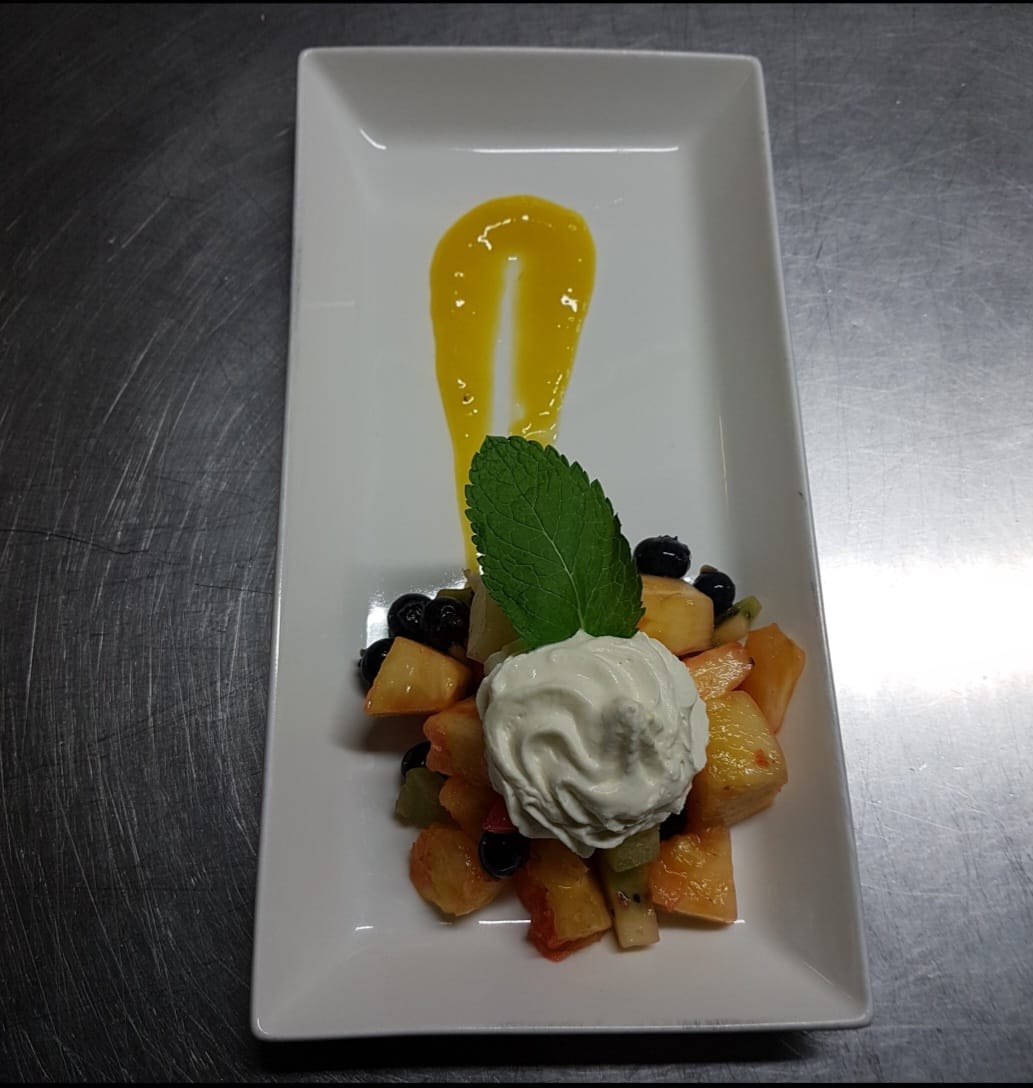 Fruit Salad garnish with mango & fresh mint  Image